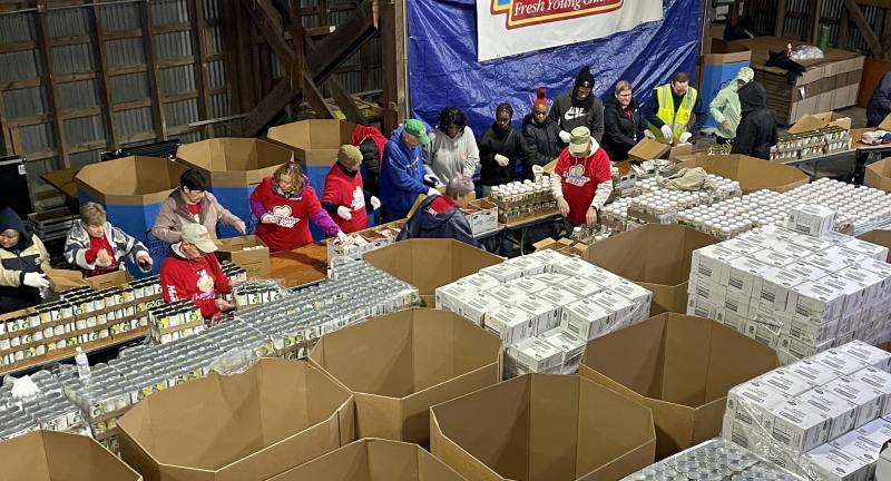 Volunteers pack 8,000 Easter food boxes