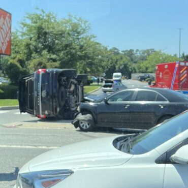 Car flips on Route 1 near Home Depot
